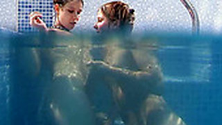 Seductive Brunette Lesbians Tickle Their Snatches Under Water In Pool